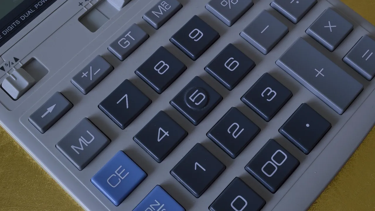 A calculator beside retirement planning papers